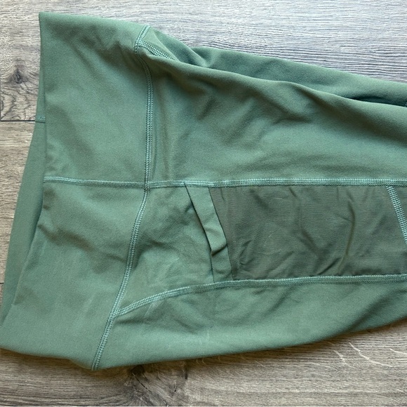 Fabletics Olive High-Rise Pocketed Bike Shorts - Picture 3 of 5